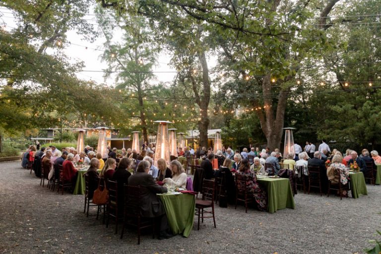 Guests enjoy dinner under the Stratford Garden's heritage oak canopy